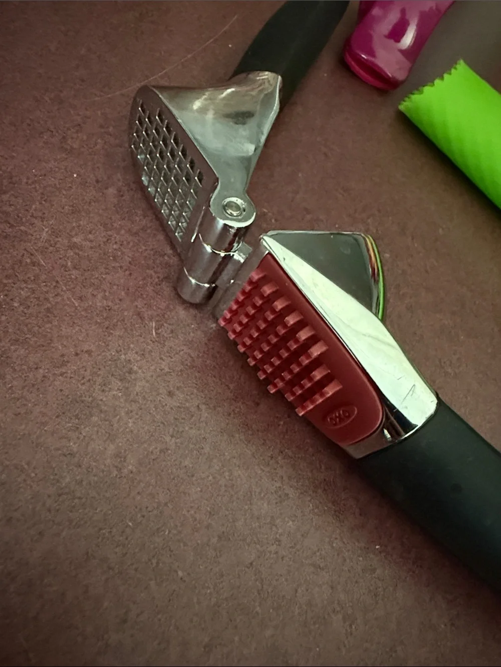 Oxo Black Garlic Press with Green Silicone Peeler and Pink Clip